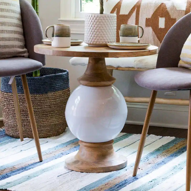 Tavolo rotondo con piedistallo in legno di mango e metallo,