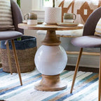 Tavolo rotondo con piedistallo in legno di mango e metallo,