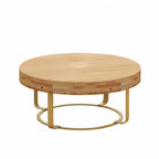 Tavolino da caffè rotondo moderno con motivo intagliato in legno e gambe in metallo